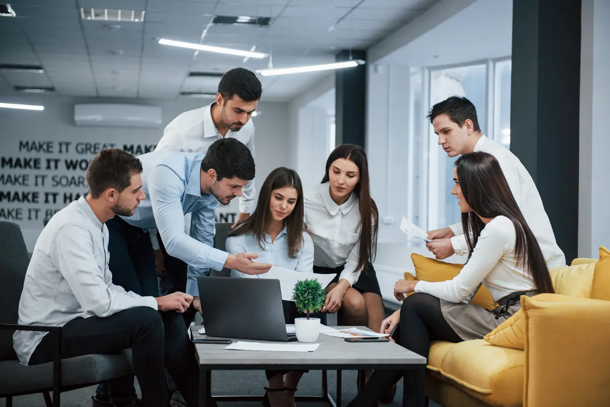 Team members collaborating in a bright, open office